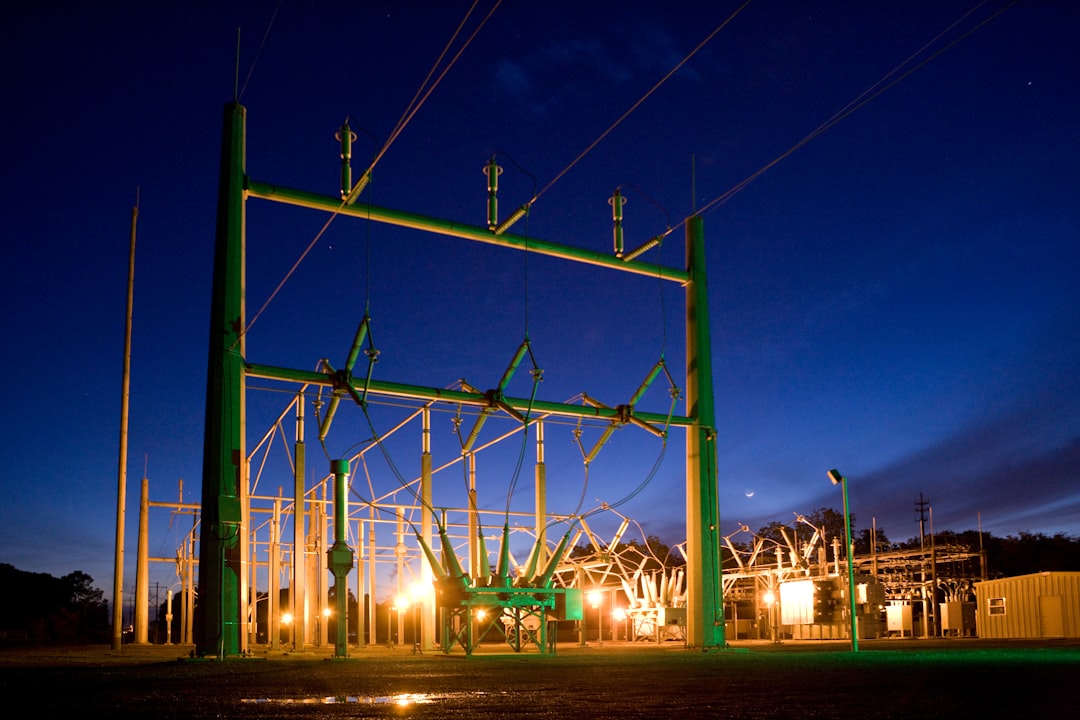 Electrical substation illuminated at dusk